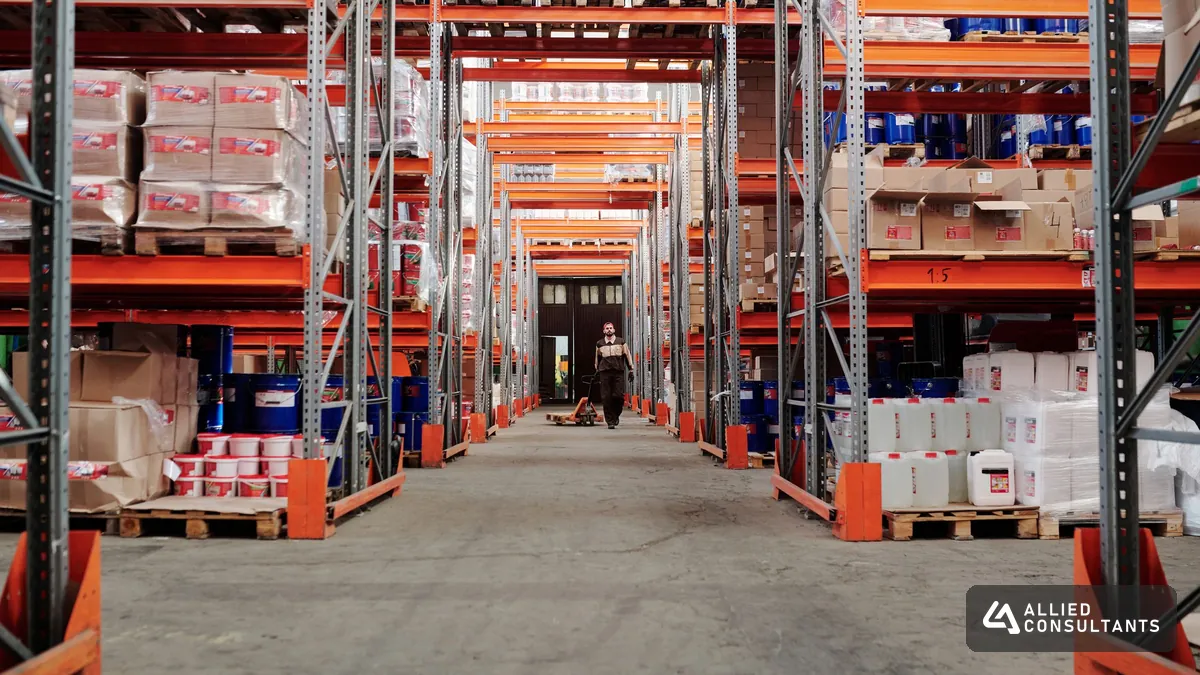 Warehouse aisle with stock on metal shelving used to measure inventory turnover